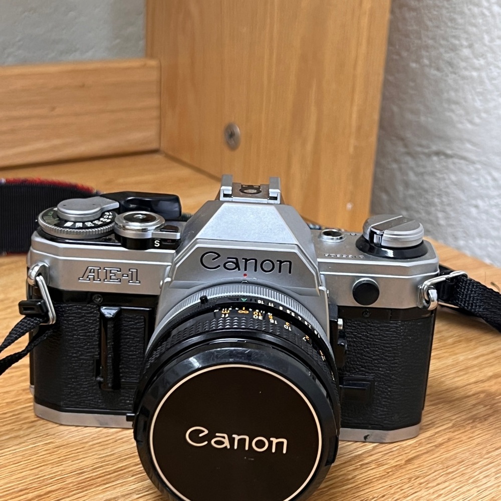Canon AE-1 Black and Silver Camera with film